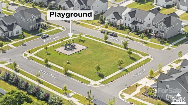 an aerial view of residential houses with outdoor space