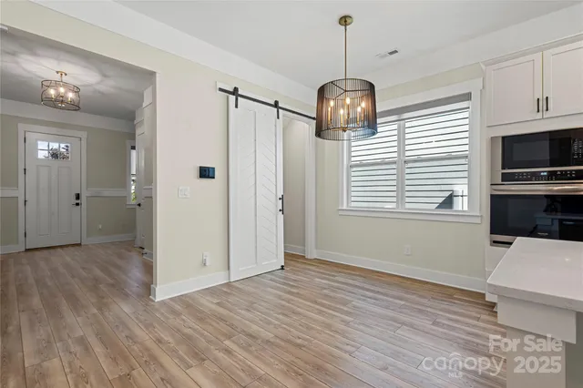 a view of a kitchen from the hallway