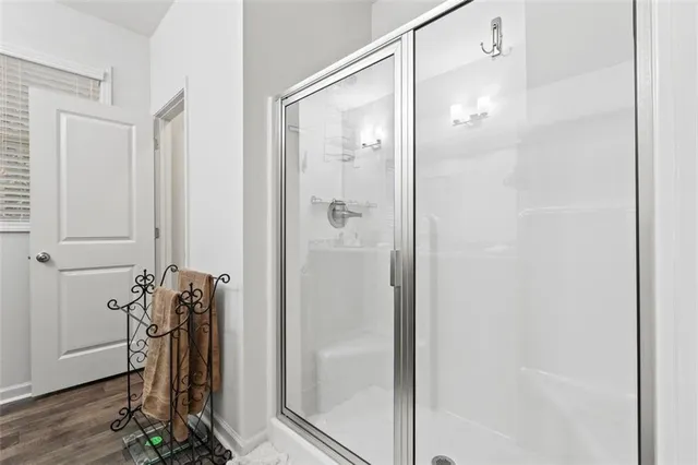 a bathroom with a glass shower door