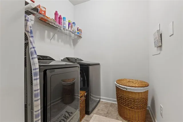 a utility room with dryer and washer