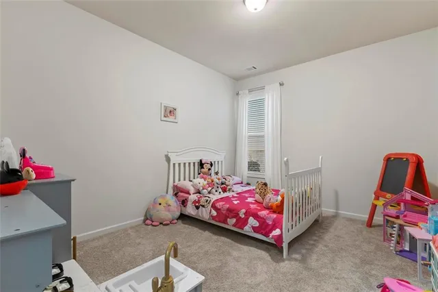 a bedroom with furniture and a window