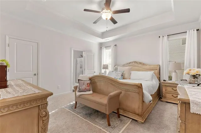 a bedroom with a bed and a couch