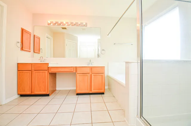 a bathroom with a sink a vanity and a mirror