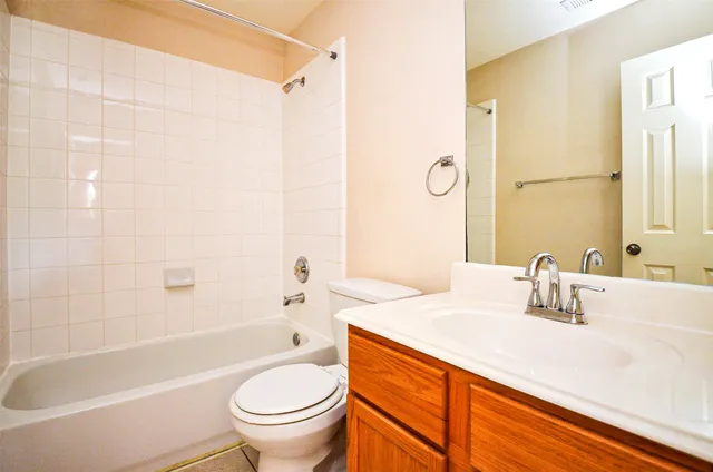 a bathroom with a sink a toilet and a bathtub