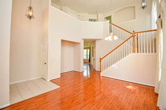a view of an entryway with wooden floor