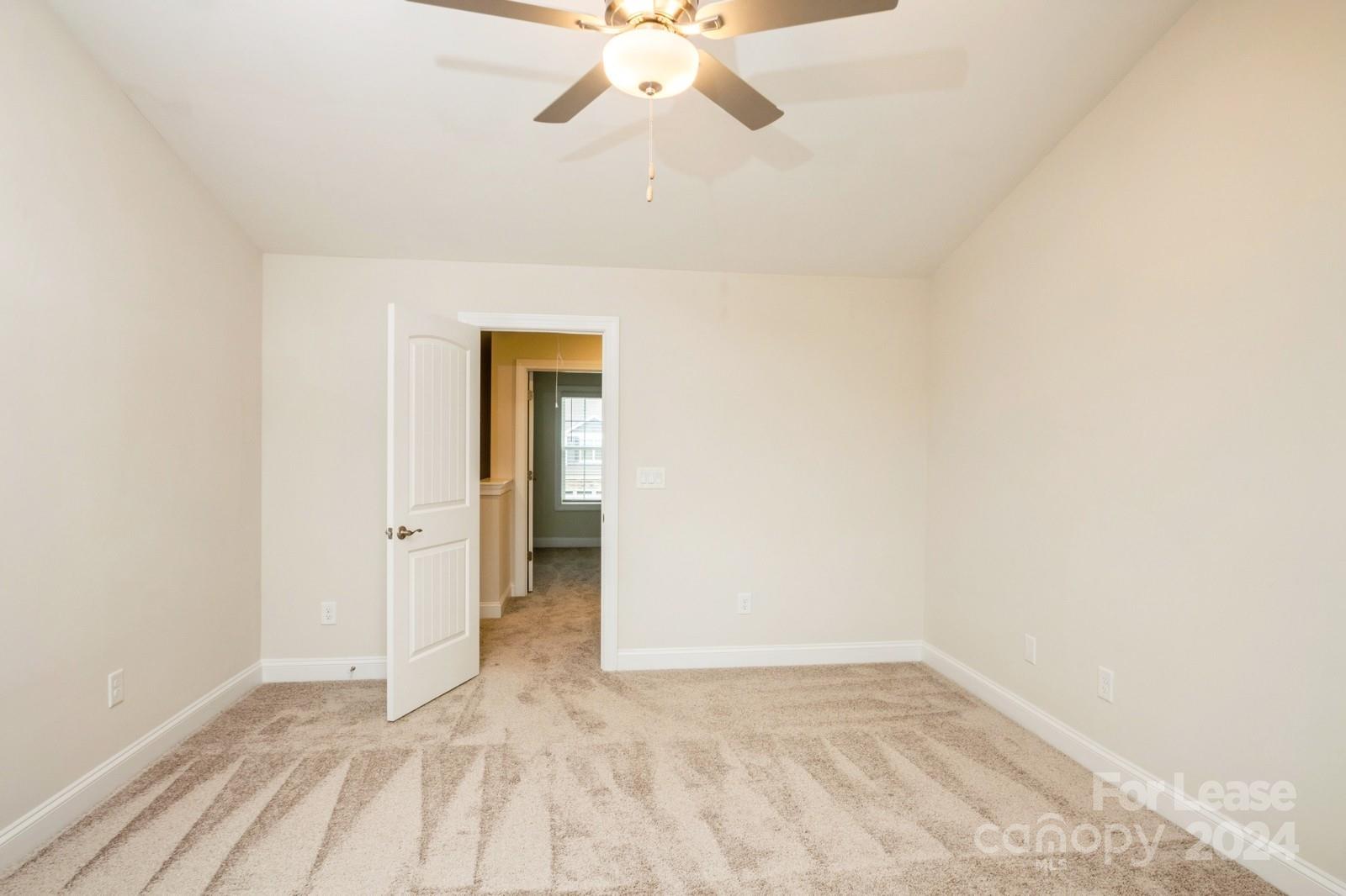 131 Brixham Loop Troutman, NC 28166 - Photo 12 of 26 a view of an empty room