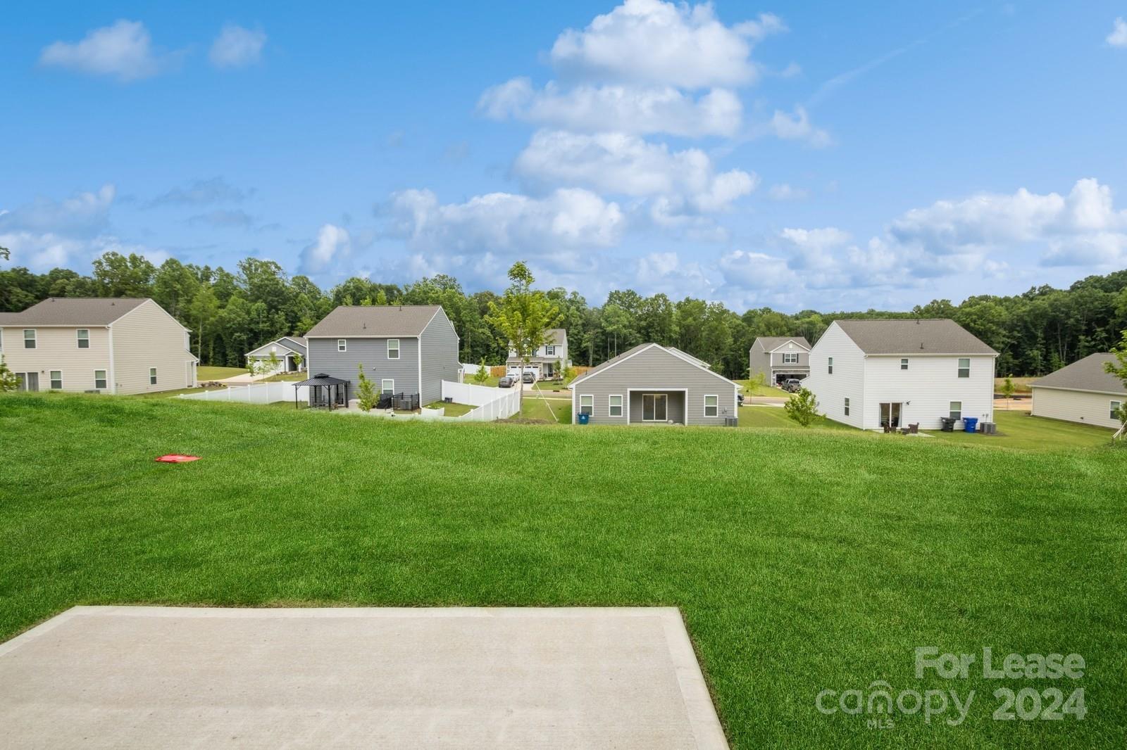 131 Brixham Loop Troutman, NC 28166 - Photo 25 of 26 a view of a house with garden