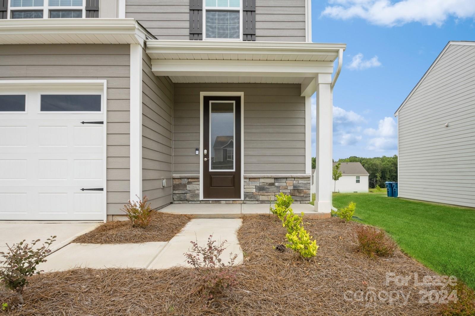 131 Brixham Loop Troutman, NC 28166 - Photo 3 of 26 a view of a house with patio