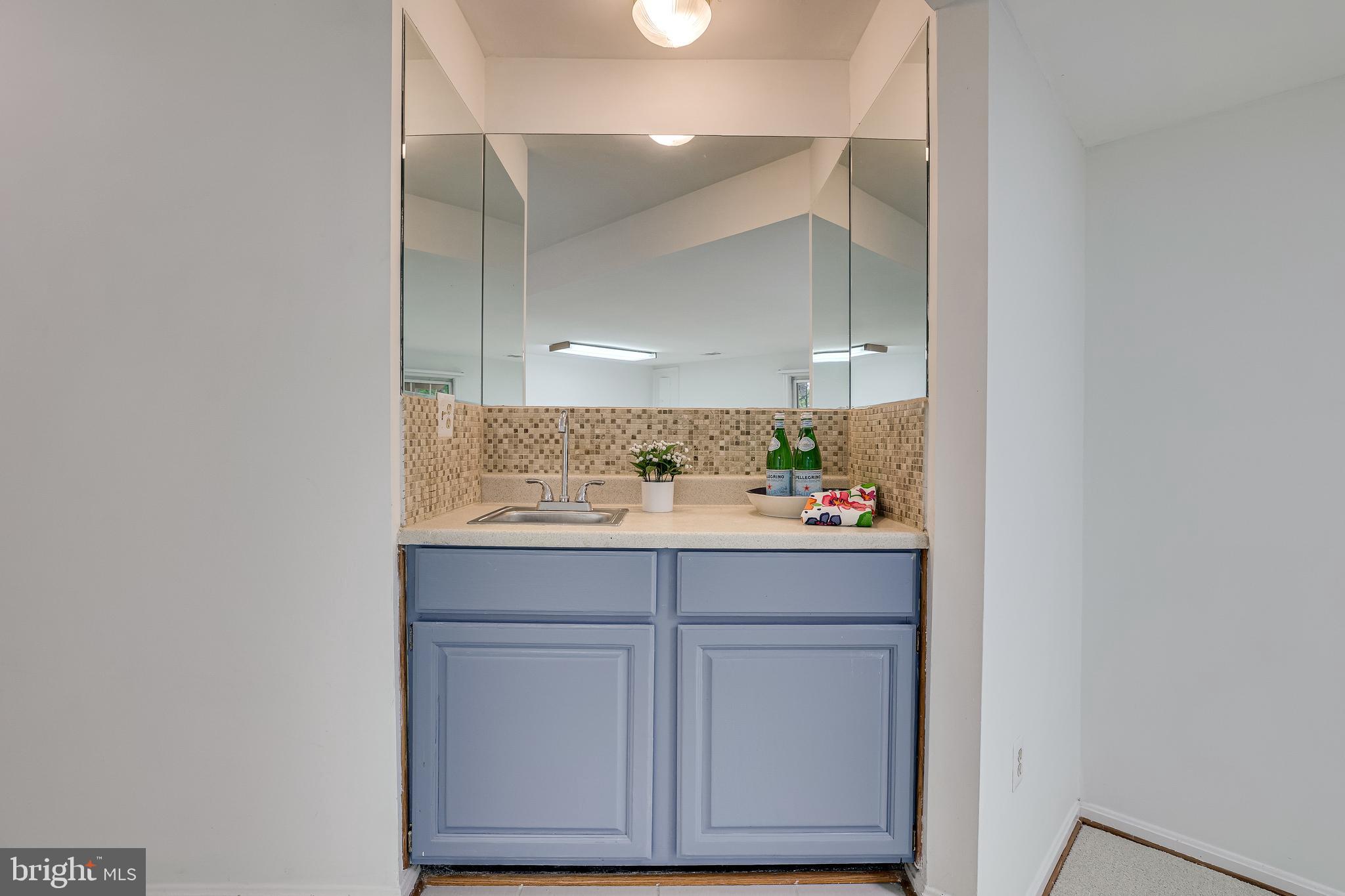 11962 Sentinel Point Court Reston, VA 20191 - Photo 47 of 62 The recreation room has a wet bar.