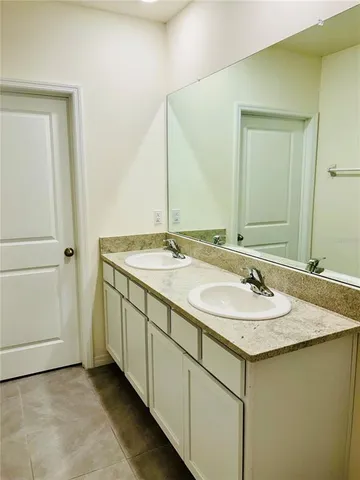 a bathroom with a shower and a sink