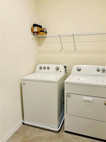 a view of an house with backyard space and windows