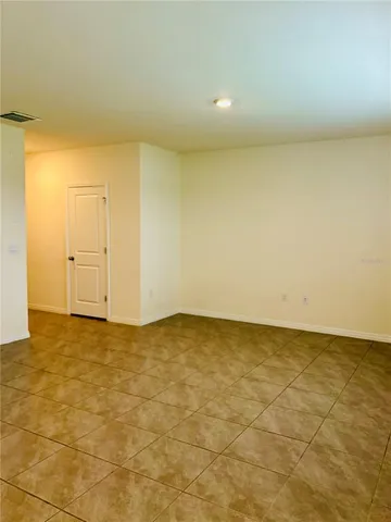 an empty room with a empty space and window