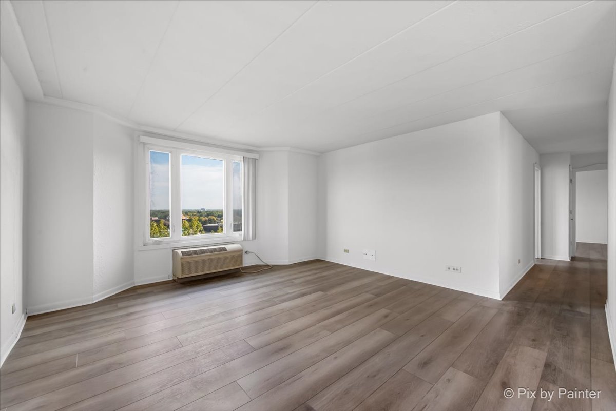 1 Renaissance Place, Unit 1017 Palatine, IL 60067 - Photo 12 of 30 a view of an empty room with wooden floor and a window