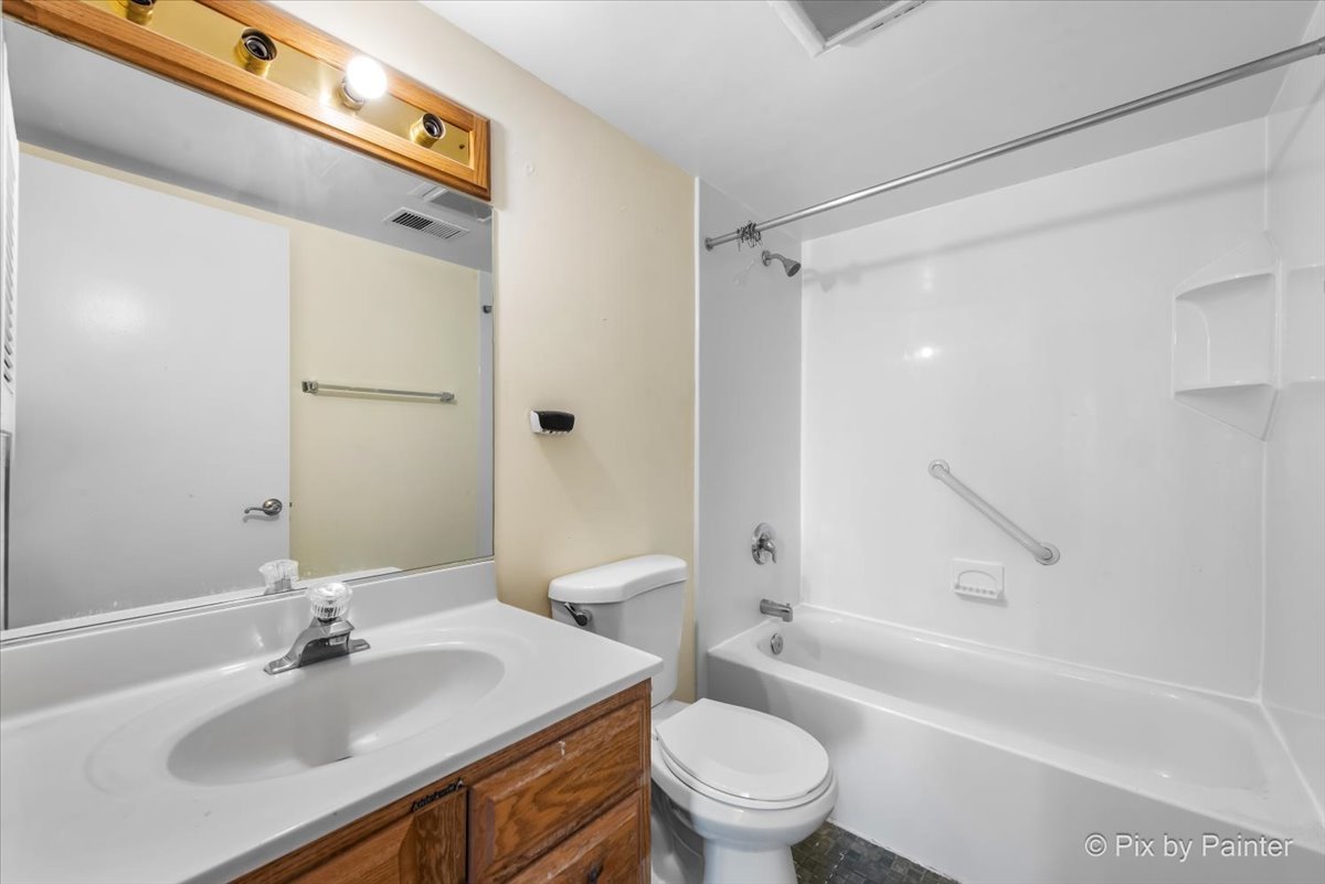 1 Renaissance Place, Unit 1017 Palatine, IL 60067 - Photo 22 of 30 a bathroom with a sink toilet vanity and shower