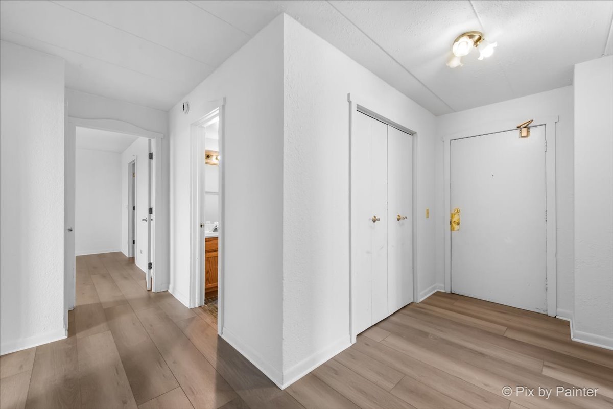 1 Renaissance Place, Unit 1017 Palatine, IL 60067 - Photo 4 of 30 a view of a hallway with wooden floor and a bathroom
