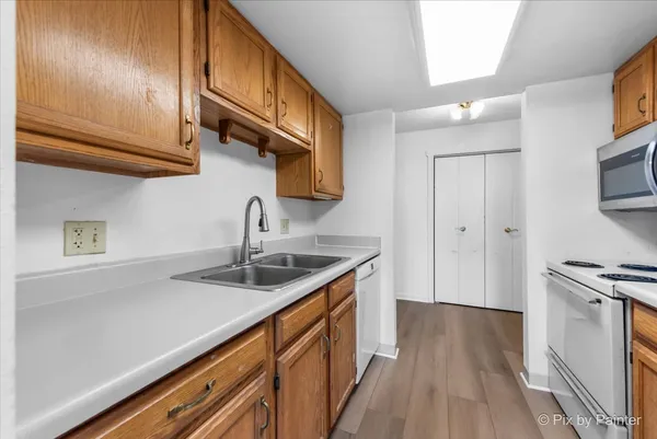 a kitchen with stainless steel appliances granite countertop a sink and cabinets