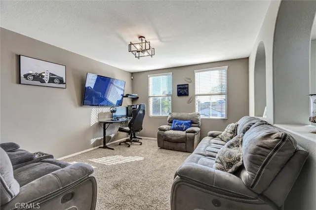 a living room with furniture window and a couch