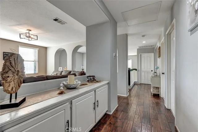 a spacious bathroom with a double vanity sink and a mirror