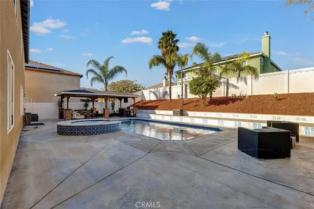 a view of pool with outdoor seating
