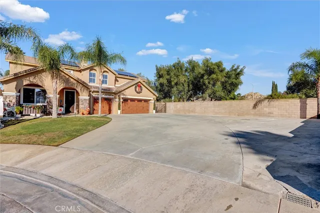 a view of house with yard