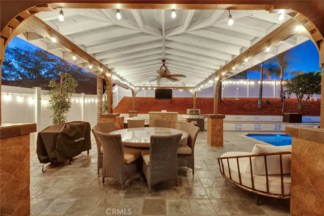 a living room with stainless steel appliances kitchen island granite countertop a couch