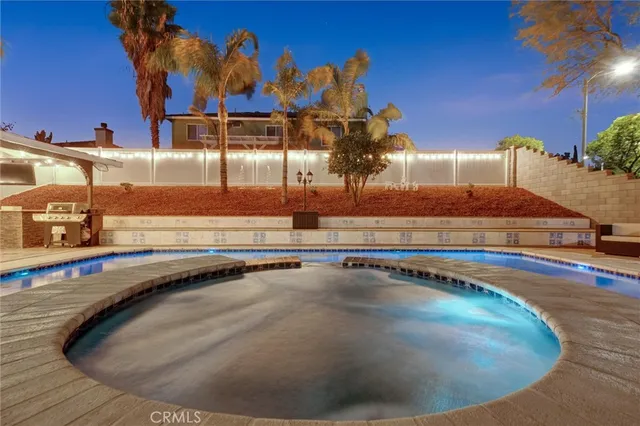 a view of a patio with swimming pool