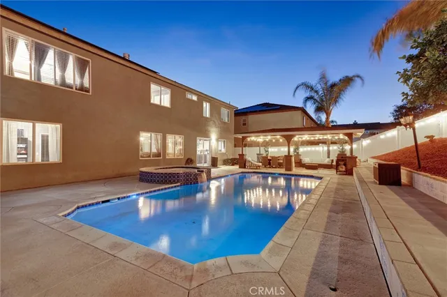 a view of a swimming pool with an outdoor seating