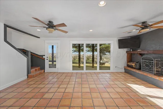 a kitchen with cabinets stainless steel appliances and a window