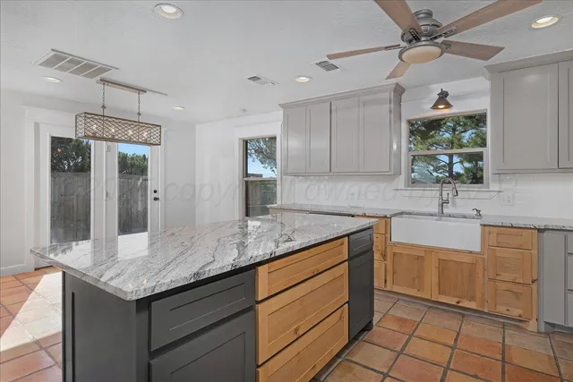 a bathroom with a sink toilet vanity and shower