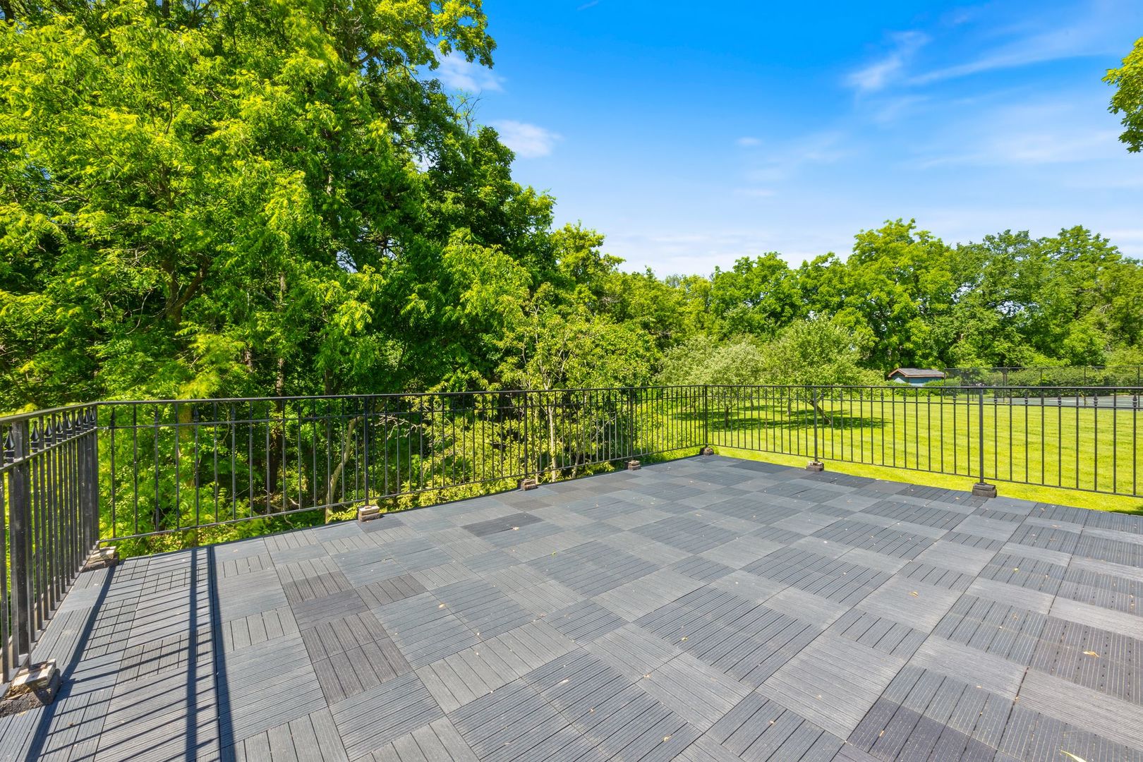 541 Merri Oaks Road Barrington Hills, IL 60010 - Photo 41 of 60 a view of a tennis court with a trees in the background