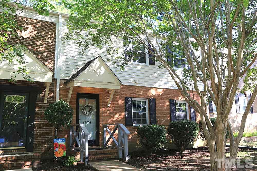 6579 New Market Way, Unit 6579 Raleigh, NC 27615 - Photo 2 of 22 a front view of a house with tree s
