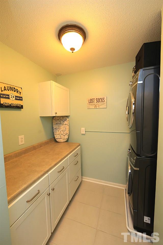 6579 New Market Way, Unit 6579 Raleigh, NC 27615 - Photo 16 of 22 a kitchen with a sink and cabinets