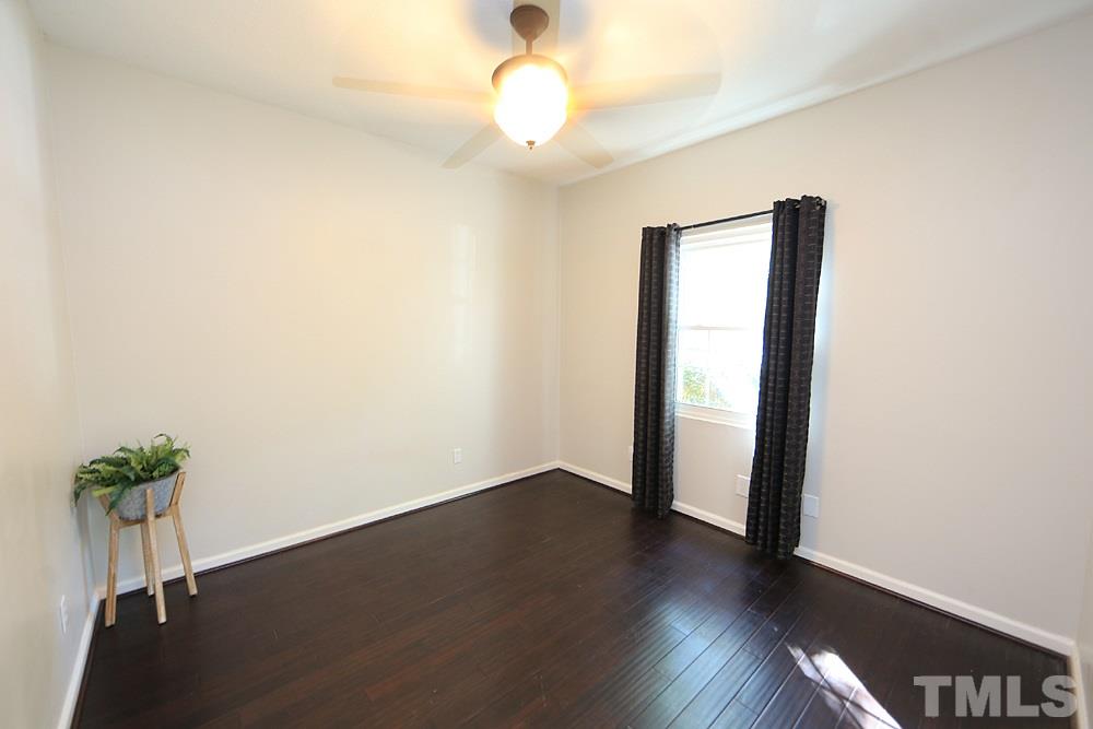 6579 New Market Way, Unit 6579 Raleigh, NC 27615 - Photo 17 of 22 a view of an empty room with wooden floor
