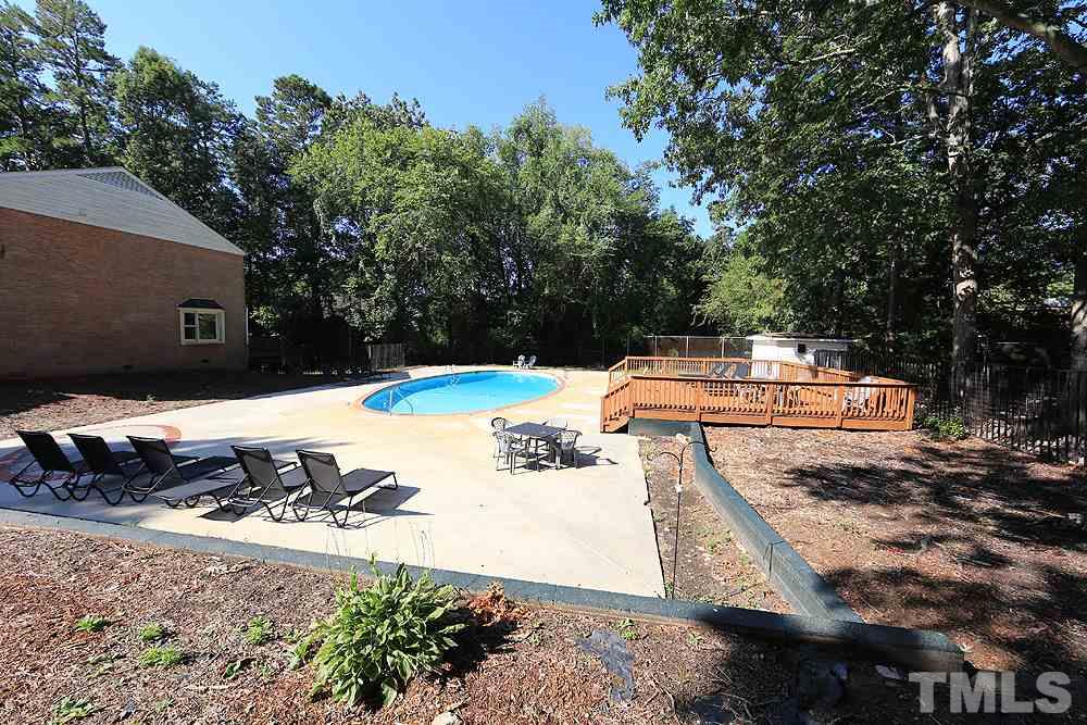 6579 New Market Way, Unit 6579 Raleigh, NC 27615 - Photo 21 of 22 a view of a yard with chairs