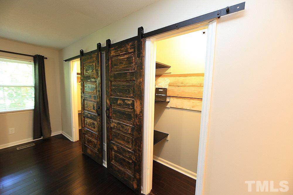 6579 New Market Way, Unit 6579 Raleigh, NC 27615 - Photo 9 of 22 a view of walk in closet with wooden floor