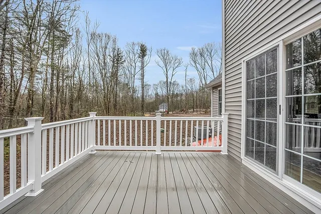 a view of a roof with wooden floor and fence