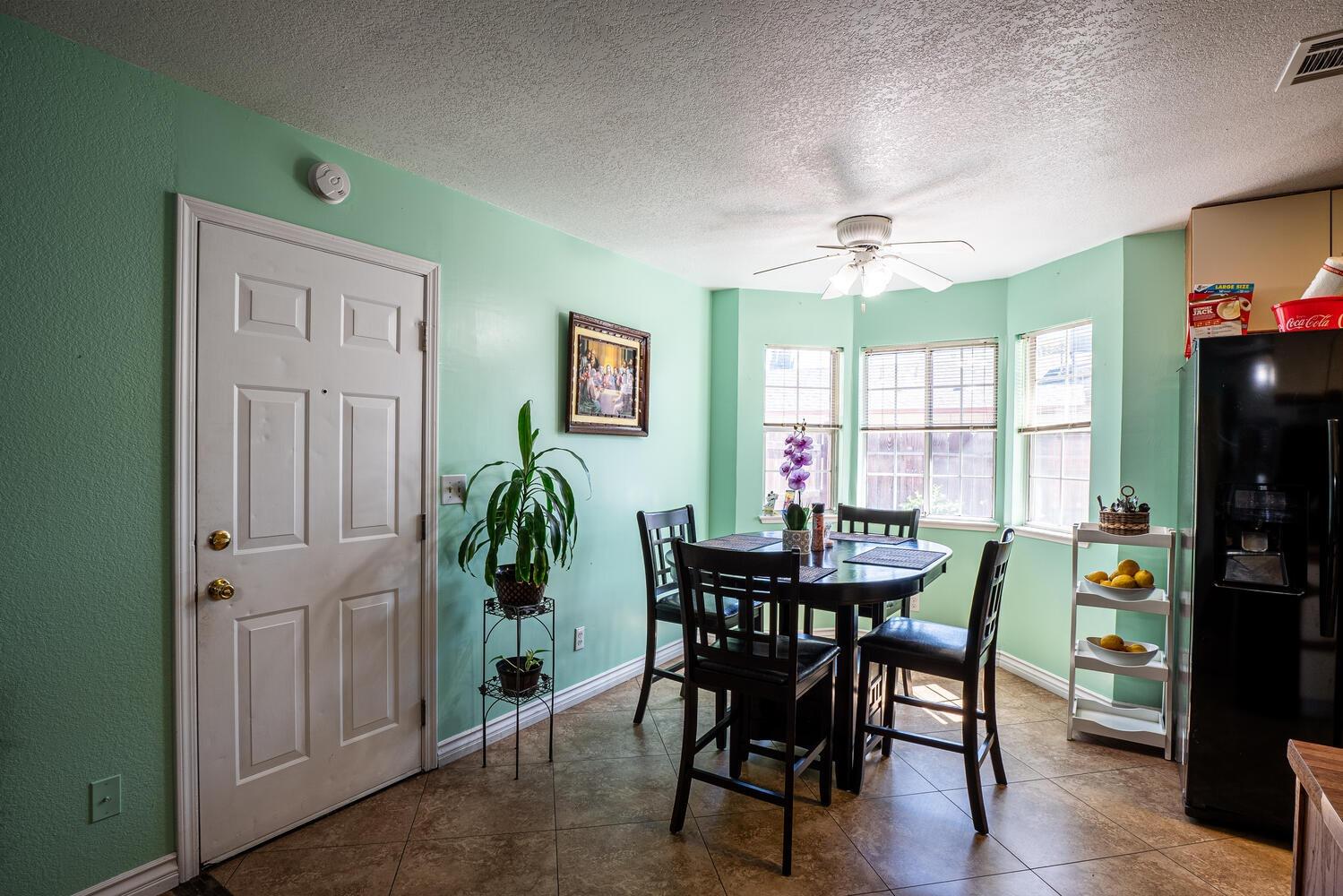 802 West Center Street Manteca, CA 95337 - Photo 16 of 29 a view of a dining room with furniture window and outside view