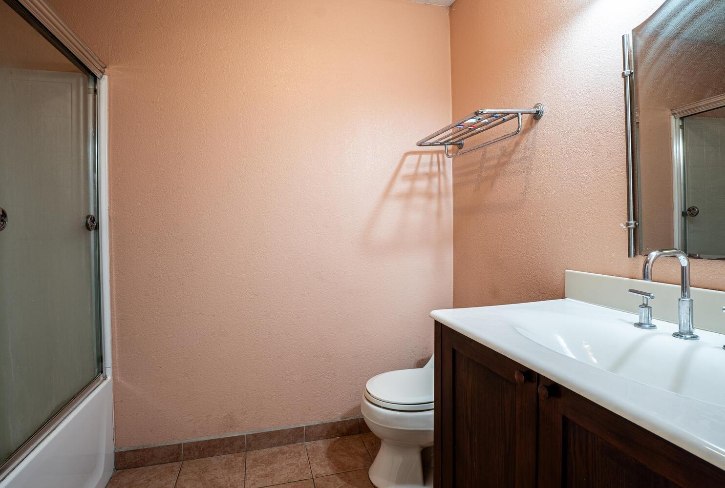 802 West Center Street Manteca, CA 95337 - Photo 20 of 29 a bathroom with a sink a toilet and mirror
