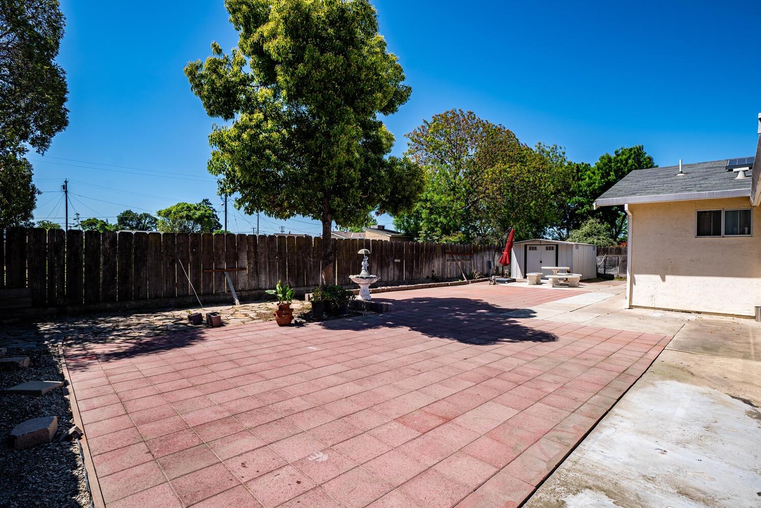 802 West Center Street Manteca, CA 95337 - Photo 22 of 29 a view of a backyard with a tree