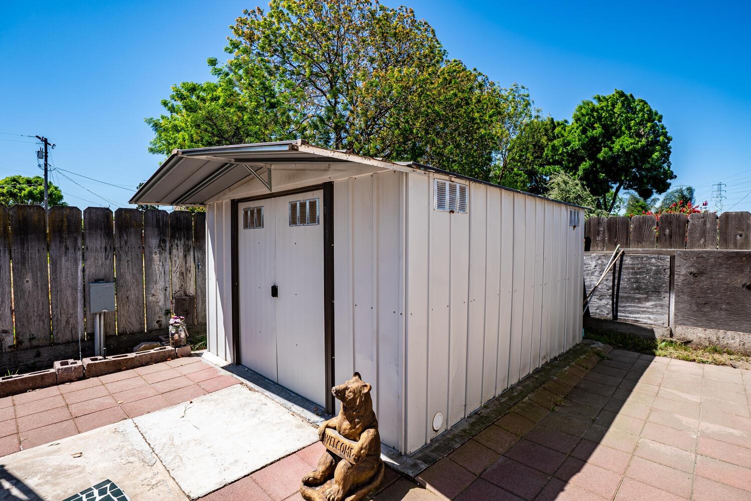 802 West Center Street Manteca, CA 95337 - Photo 29 of 29 a view of a house with backyard and trees