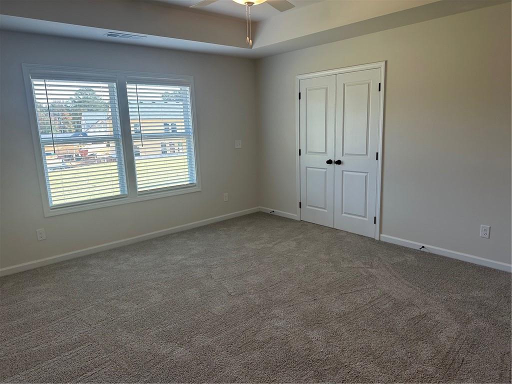 315 Rodeo Drive Auburn, GA 30011 - Photo 11 of 33 an empty room with windows