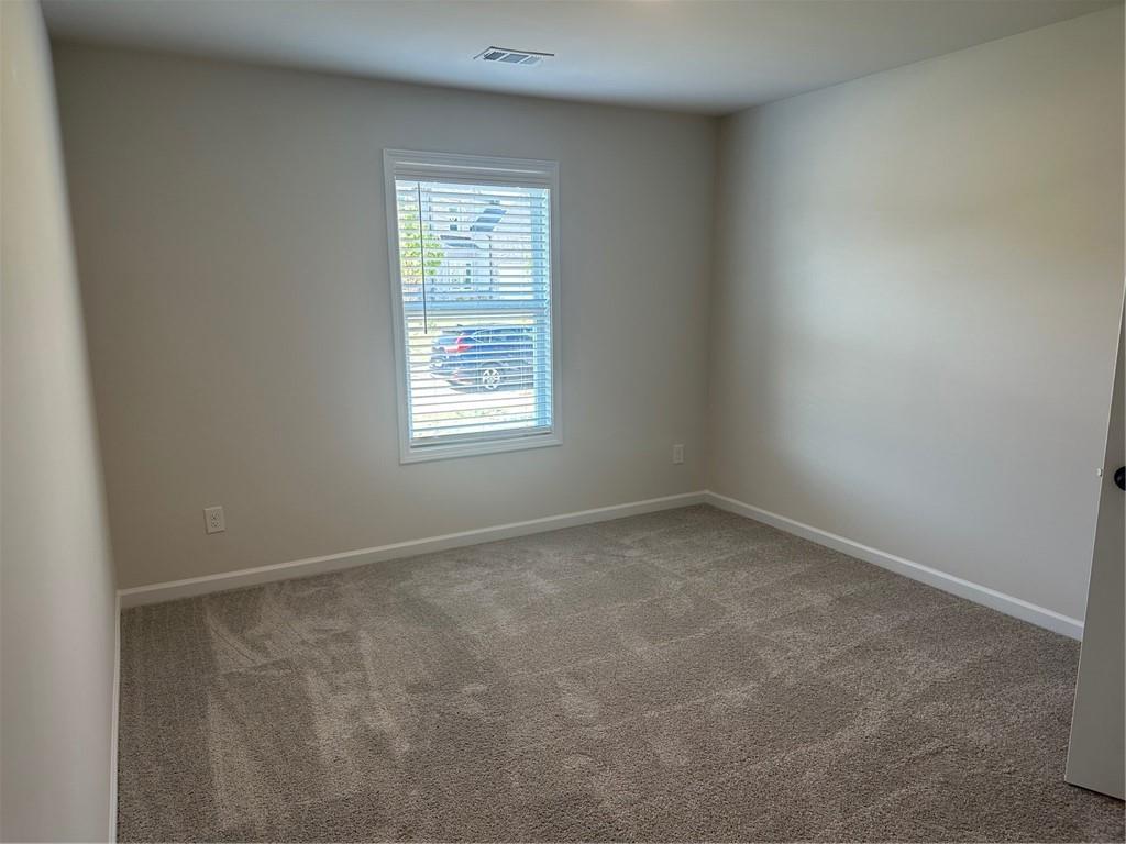 315 Rodeo Drive Auburn, GA 30011 - Photo 21 of 33 an empty room with a window