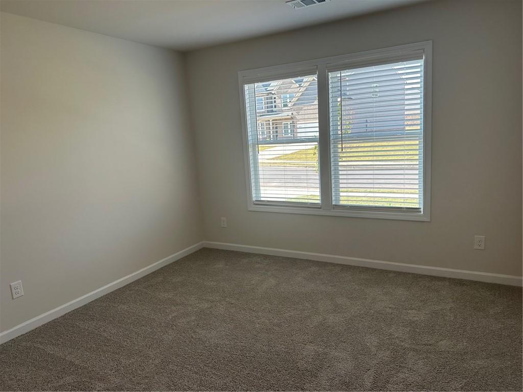 315 Rodeo Drive Auburn, GA 30011 - Photo 26 of 33 an empty room with a window