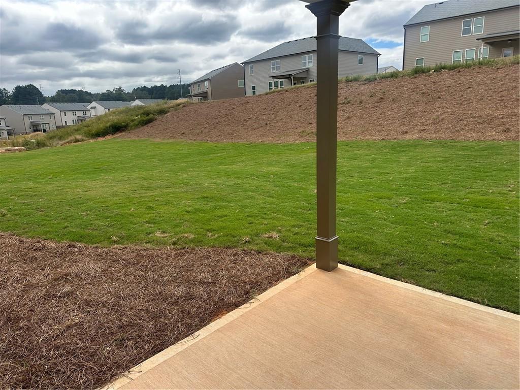 315 Rodeo Drive Auburn, GA 30011 - Photo 32 of 33 a backyard of a house with lots of green space