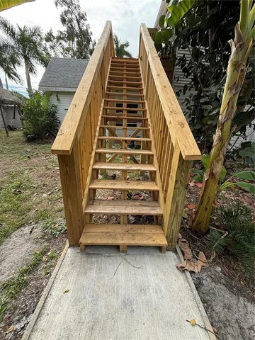 a kitchen with stainless steel appliances a refrigerator sink and cabinets