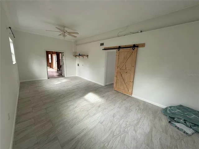 a view of a swimming pool with chairs