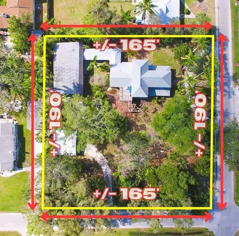 aerial view of a house with a yard