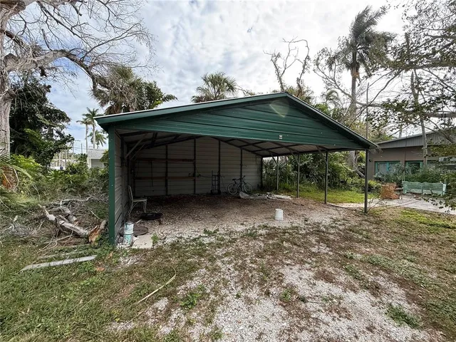 a view of a field with trees around