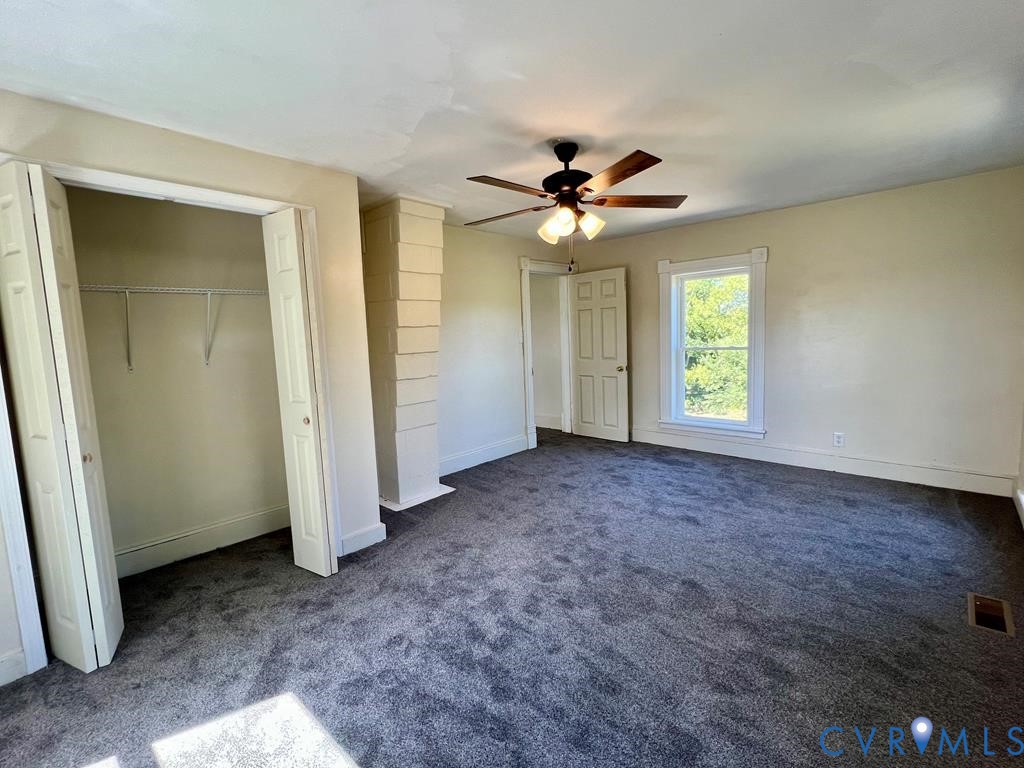 40 Coan Wharf Road Heathsville, VA 22473 - Photo 17 of 28 an empty room with windows and fan