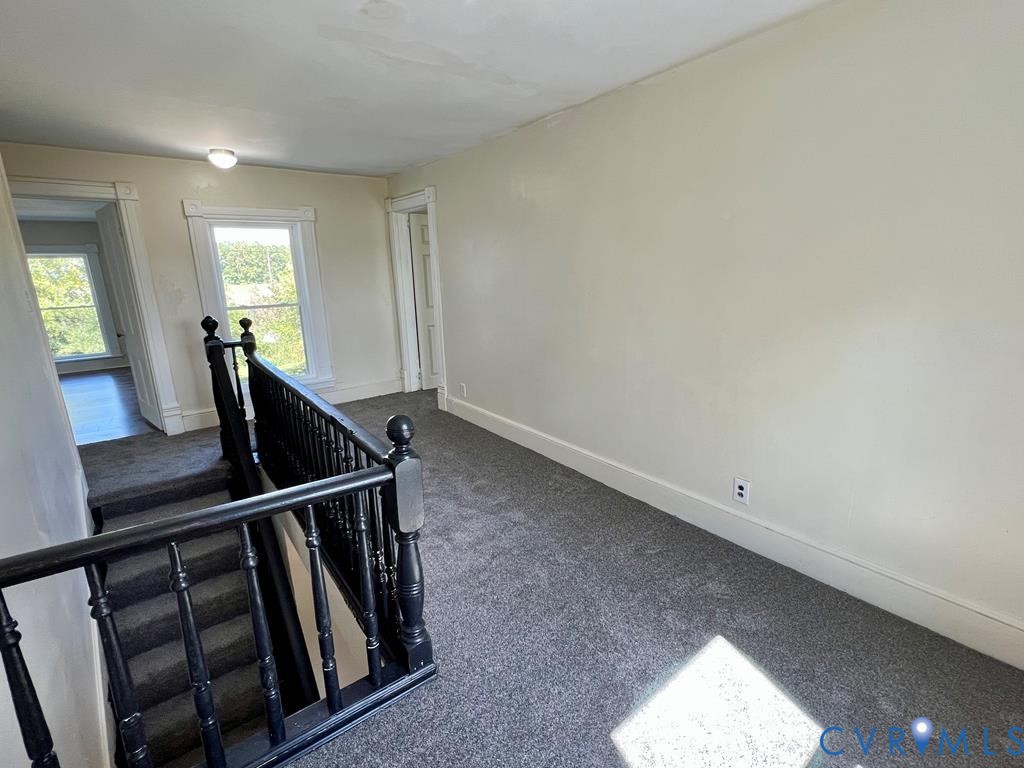 40 Coan Wharf Road Heathsville, VA 22473 - Photo 19 of 28 a view of a hallway with wooden floor and stairs